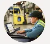 Employee using QuickBooks Enterprise in warehouse
