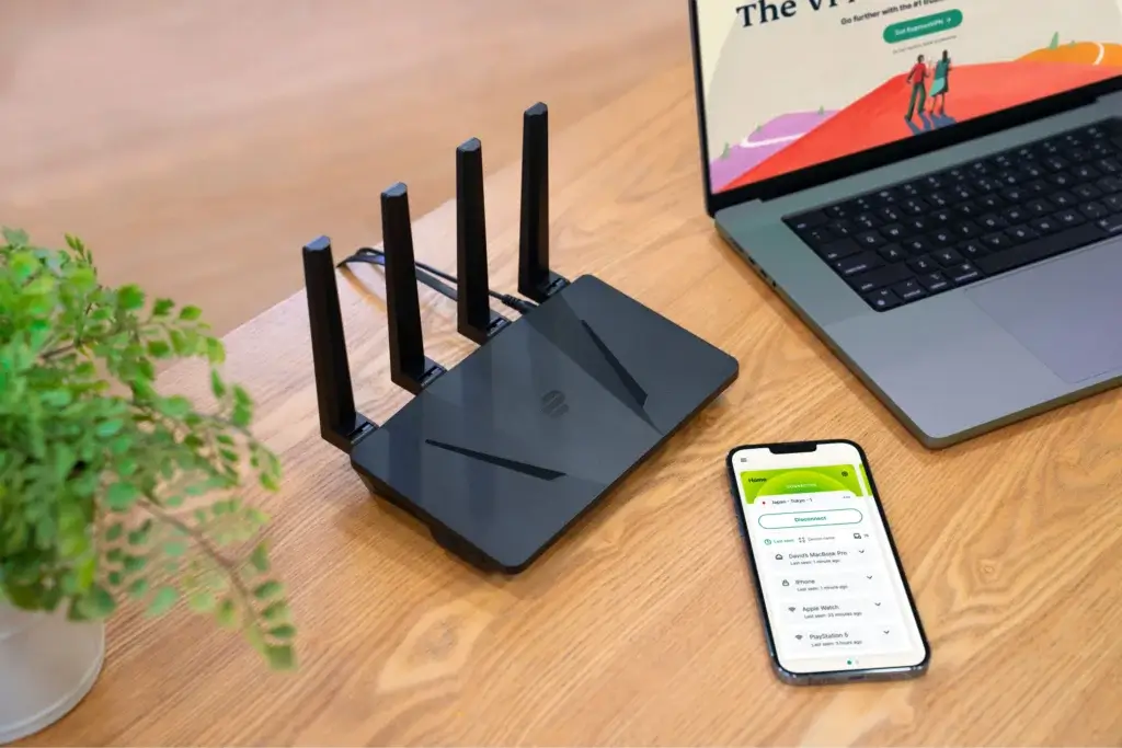 ExpressVPN Aircove router connected to laptop and smartphone
