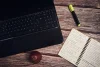 Laptop and notebook on a desk for content writing and editing
