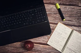 Laptop and notebook on a desk for content writing and editing