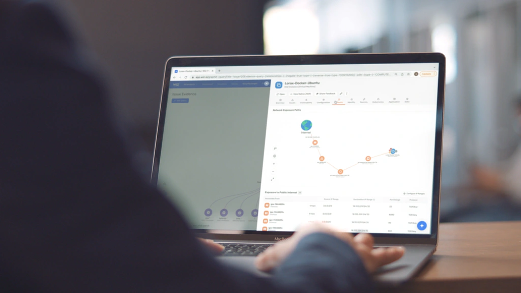 User reviewing a Wiz cloud exposure graph on a laptop